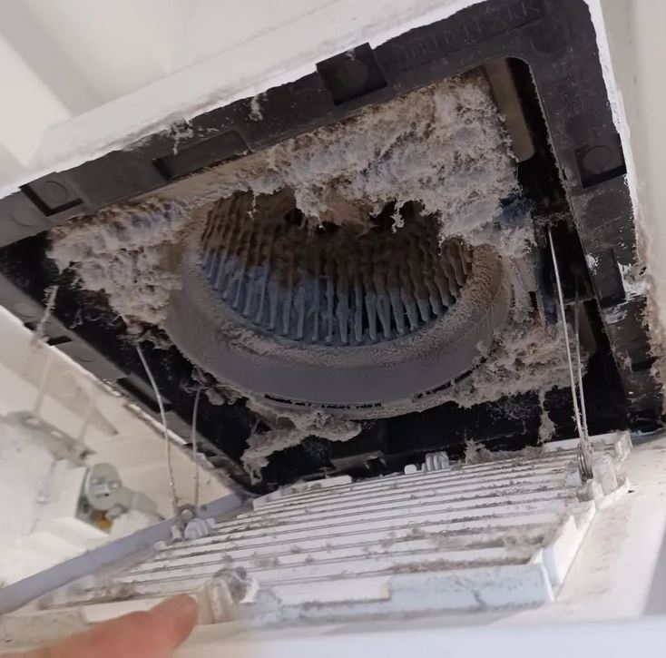 Dirty air conditioner interior with heavy dust buildup